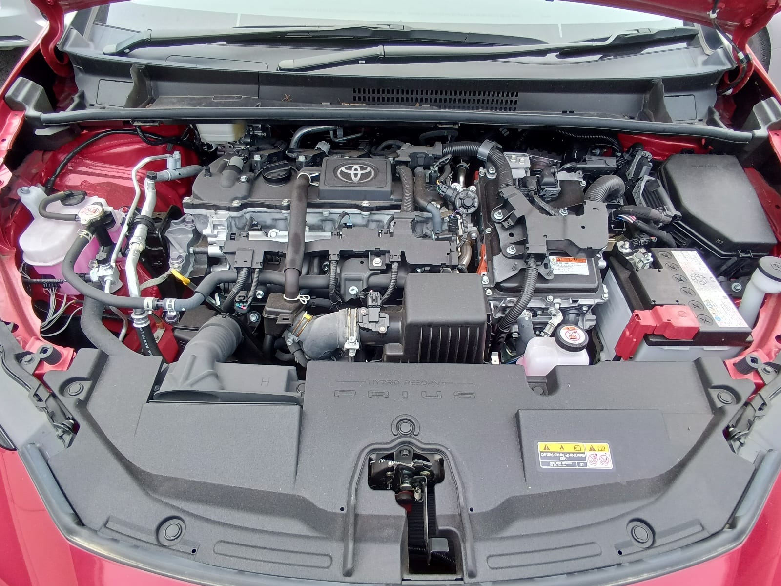 Toyota Prius A 2023 (Hybrid, Auction Grade 5) – Red | 1,501 km | ECB Showroom | STK-250282